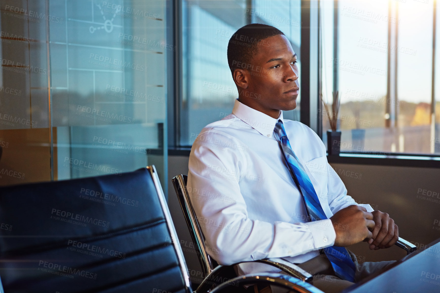 Buy stock photo Cropped shot of a businessman sitting thoughtfully in his office