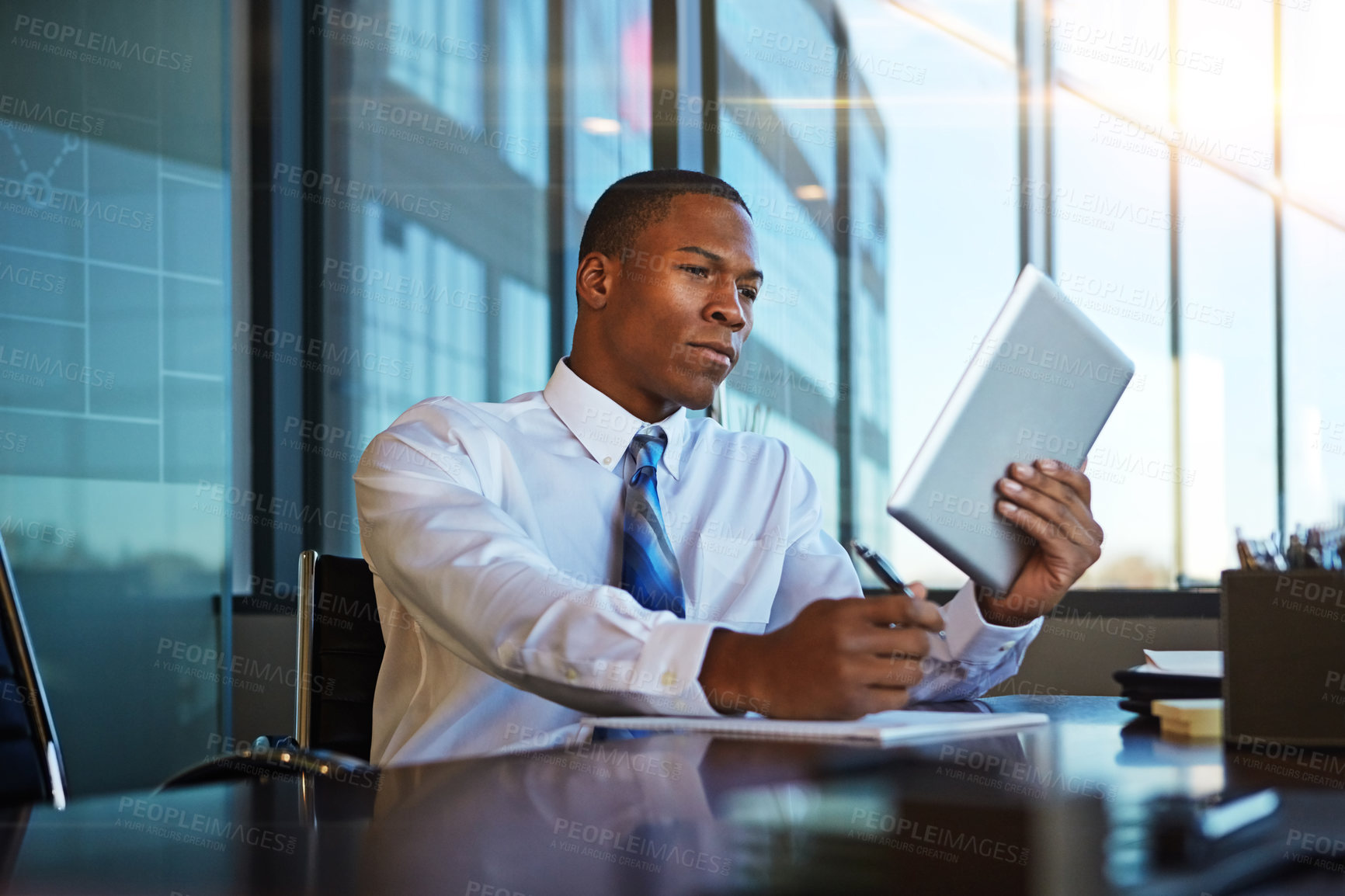 Buy stock photo Black man, accountant and writing with tablet for finance, legal paperwork or budget planning at office. Young businessman or financial advisor taking notes with technology for report or accounting