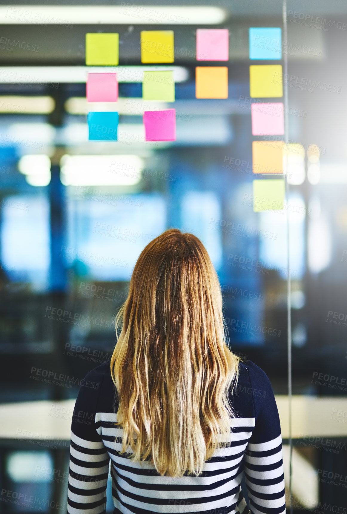 Buy stock photo Back, business and woman with notes on glass wall for planning, future ideas and creative schedule. Thinking, girl and reading mind map with information, presentation agenda and project timeline
