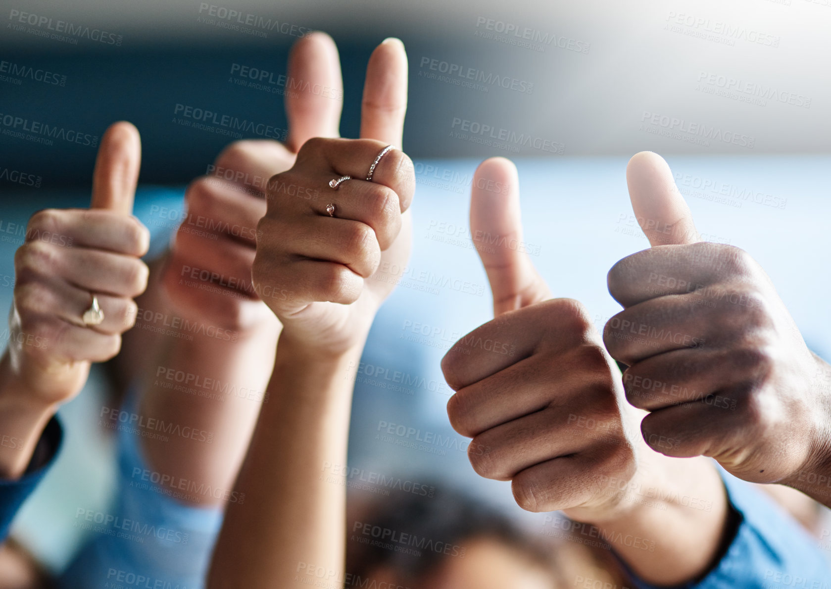 Buy stock photo Shot of a group of creative businesspeople giving thumbs up while standing in their office