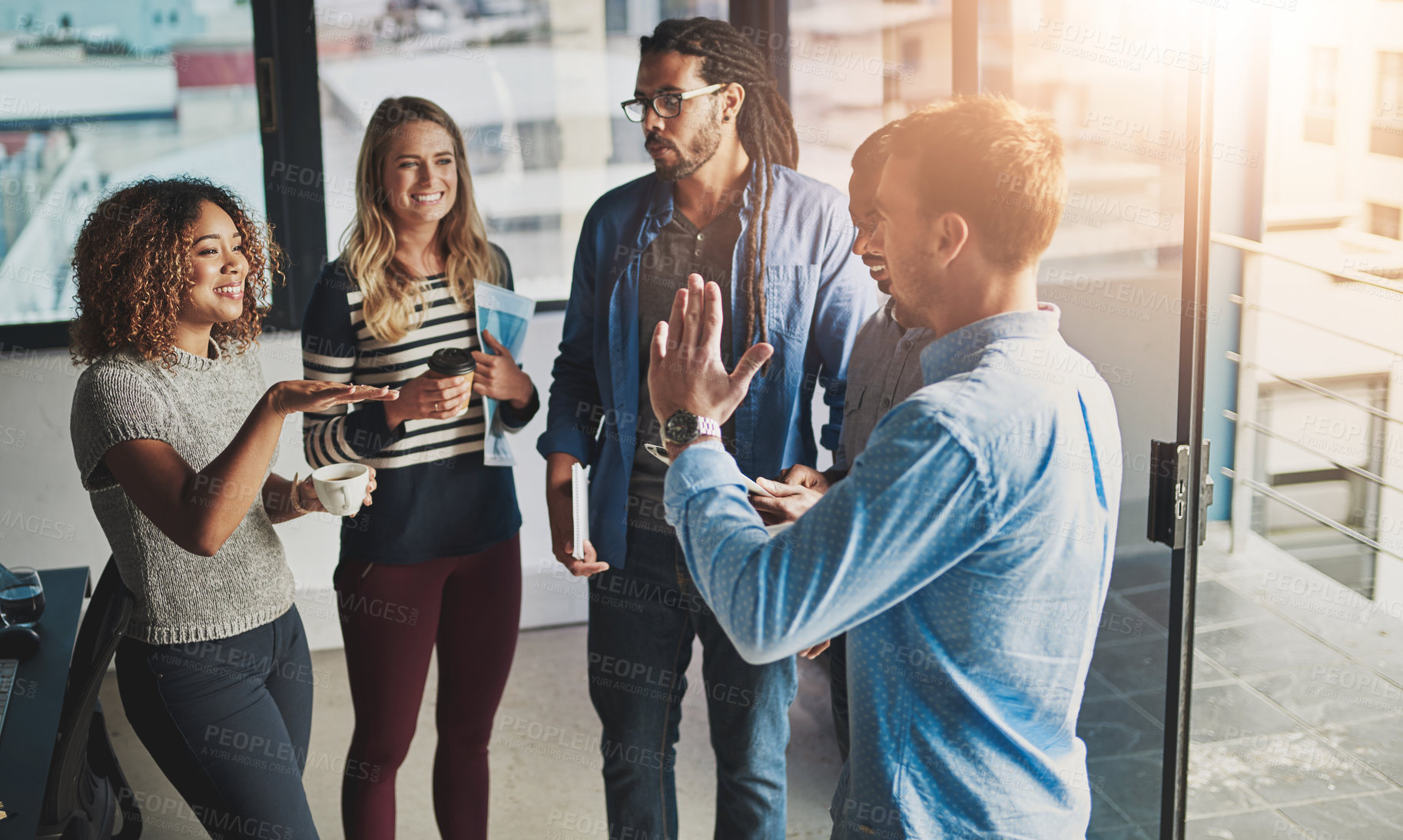 Buy stock photo Discussion, collaboration and teamwork with business people in office for planning, support or diversity. Lens flare, creative and meeting with group of employee in startup for project management