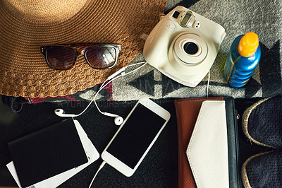 Buy stock photo High angle shot of travelling essentials on a table