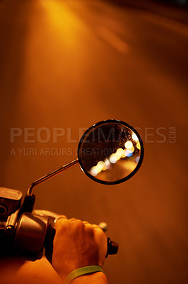 Buy stock photo POV shot of a man riding a motorbike at night
