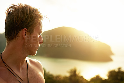 Buy stock photo Shot of a young man admiring a tropical view while on holiday