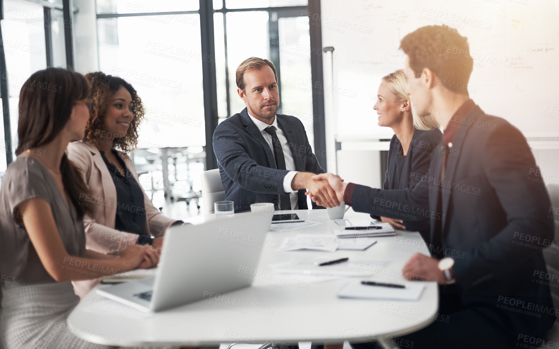 Buy stock photo Business people, handshake and meeting for hiring, partnership or agreement in team conference at office. Businessman shaking hands with employee for recruiting, b2b and corporate growth at workplace
