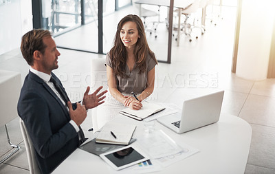 Buy stock photo Cropped shot of two businesspeople having a discussion in an office