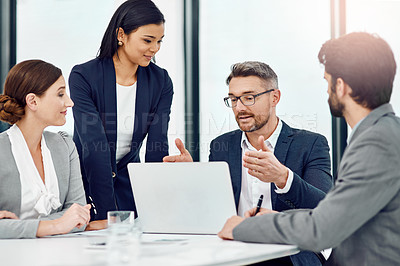 Buy stock photo Cropped shot of a group of businesspeople meeting in their office