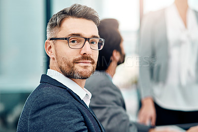 Buy stock photo Portrait of a businessman in the office with his colleagues in the background