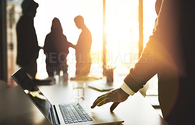 Buy stock photo Manager with laptop, team leader and boss getting ready to lead group meeting, planning and innovation with tech. Silhouette of colleagues waiting for discussion to start or begin in office boardroom