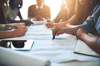 Buy stock photo Cropped shot of a group of architects working together on a project