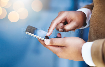 Buy stock photo Closeup shot of an unidentifiable businessman texting on his cellphone in an office