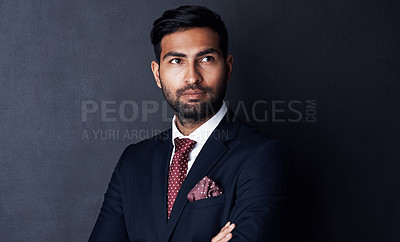 Buy stock photo Studio shot of a businessman looking thoughtful against a gray background