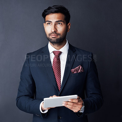 Buy stock photo Serious businessman, tablet or thinking in studio of trading ideas, future investment opportunity or planning on app. Corporate trader, indian man and remember decision, vision and digital technology