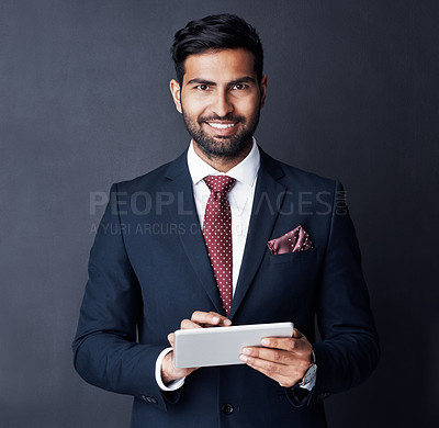 Buy stock photo Businessman, tablet and smile in studio, dark background or research stock market trading news online. Corporate trader, indian man or digital technology for investment management, finance or website