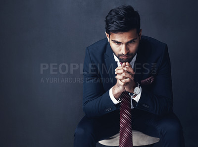 Buy stock photo Business, thinking or Indian man with stress, anxiety or employee on a dark studio background. Male person, entrepreneur or consultant confused, planning or professional with company report or worry 