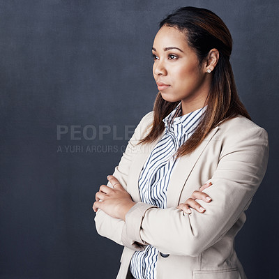 Buy stock photo Studio shot of a young woman posing against a gray background