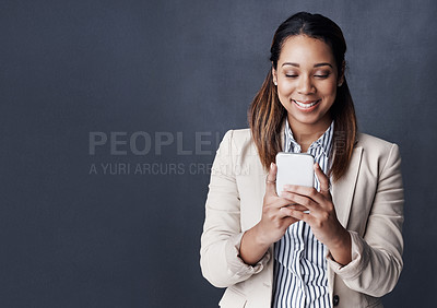 Buy stock photo Business woman, smartphone and smile in studio with notification, thinking and contact by dark background. Person, phone and happy with mockup space for mobile app, chat or networking on social media