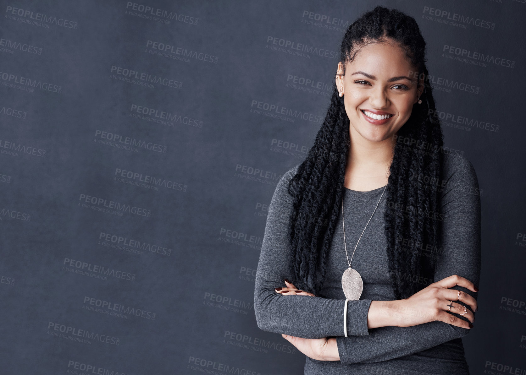 Buy stock photo Smile, intern and arms crossed with business woman in studio for fashion designer, boutique owner or pride. Confidence, opportunity and portrait of female employee on dark background for mockup space