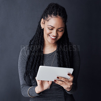 Buy stock photo Studio, happy and woman with scroll for tablet, reading blog and news story for business journalist. African person, smile and editor with research for publication, online article and dark background