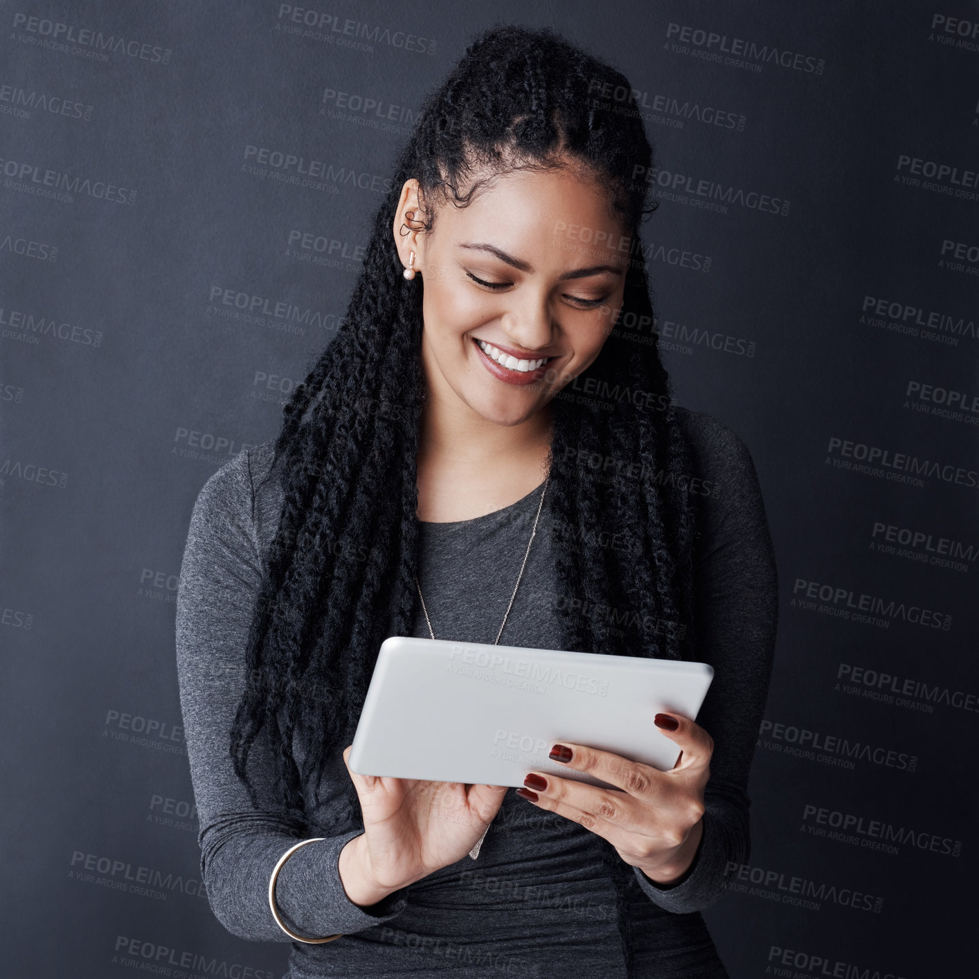 Buy stock photo Studio, happy and woman with scroll for tablet, reading blog and news story for business journalist. African person, smile and editor with research for publication, online article and dark background