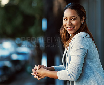 Buy stock photo Portrait of an attractive young businesswoman standing on her office balcony