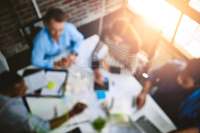 Buy stock photo High angle shot of businesspeople having a meeting in an office