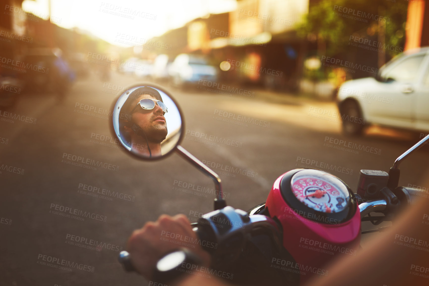 Buy stock photo Shot of a man's reflection on the side mirror of his scooter