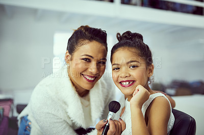 Buy stock photo Backstage, makeup or portrait of girl and stylist in studio, getting ready behind the scenes. Child model, blush cosmetics and smile with woman on set for creative preparation of celebrity talent