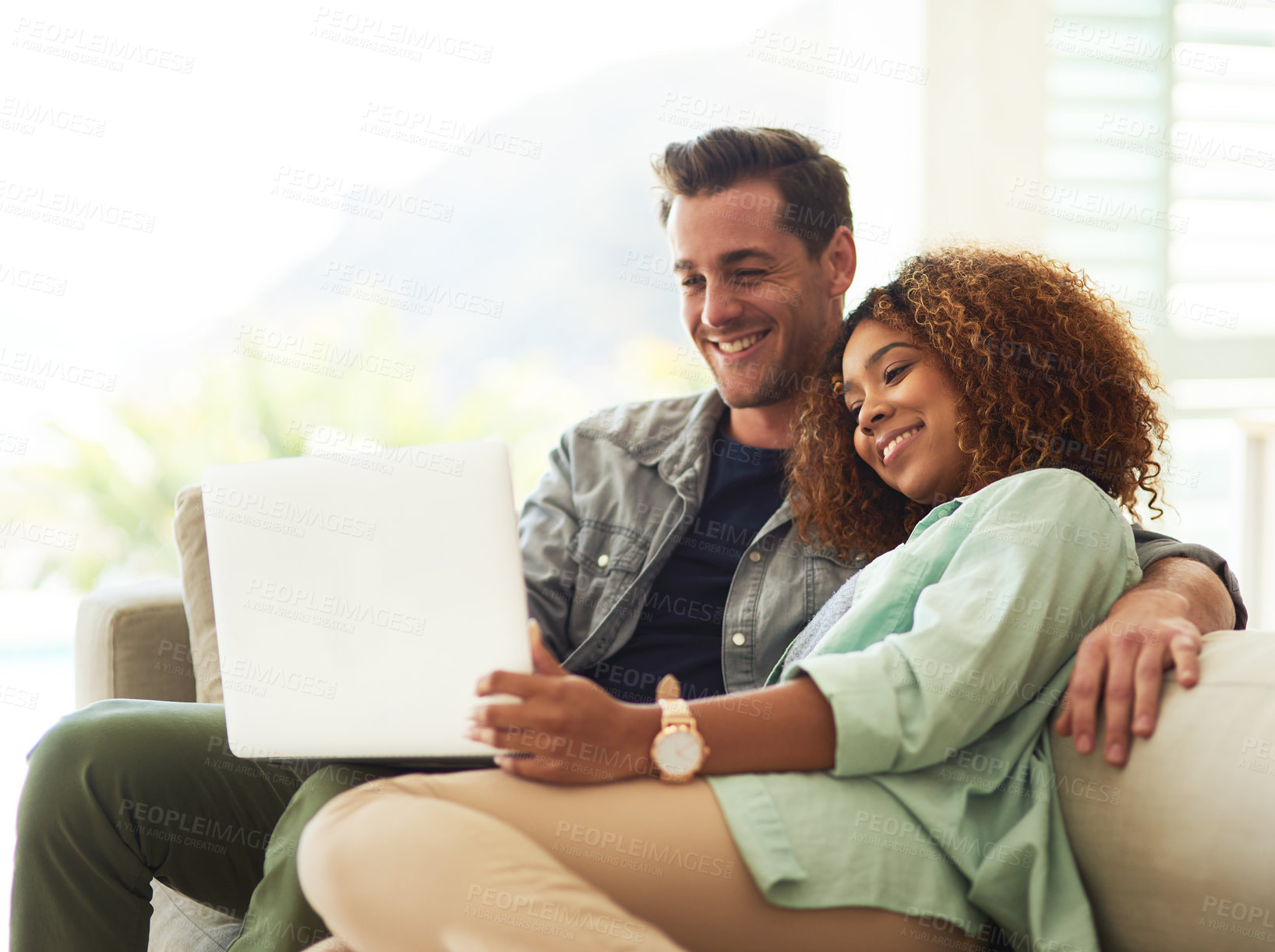 Buy stock photo Happy, internet and interracial couple with laptop for watching online video and streaming movie in living room. Smile, black woman and man with computer for social media app and subscription service