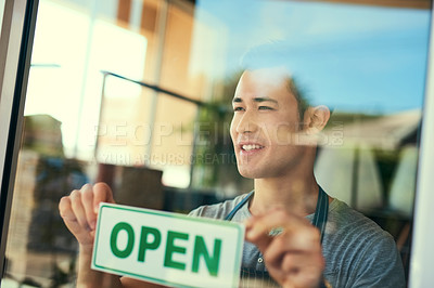 Buy stock photo Cropped shot of a young man hanging the 