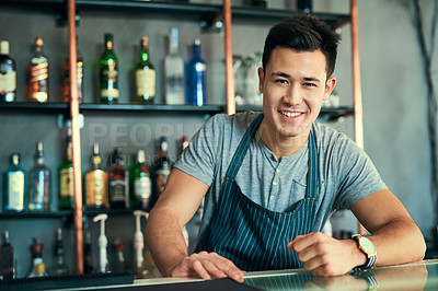 Buy stock photo Cropped portrait of a handsome young barista working in his coffee shop