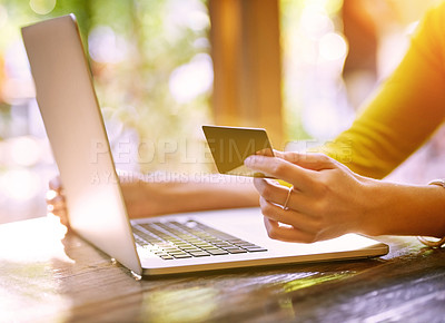 Buy stock photo Shot of an unrecognizable young woman shopping online