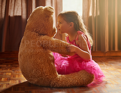 Buy stock photo Shot of a little girl playing with her teddy bear