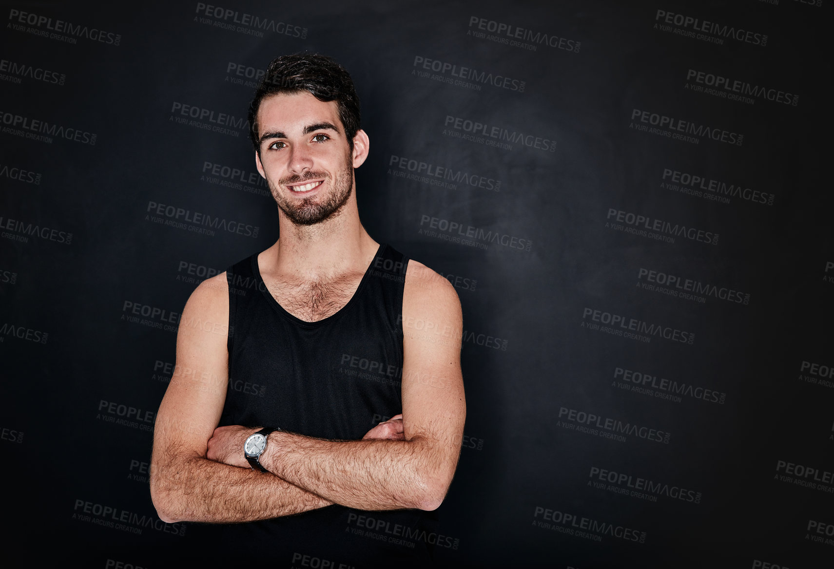 Buy stock photo Studio portrait of a fit and confident young man posing against a gray background