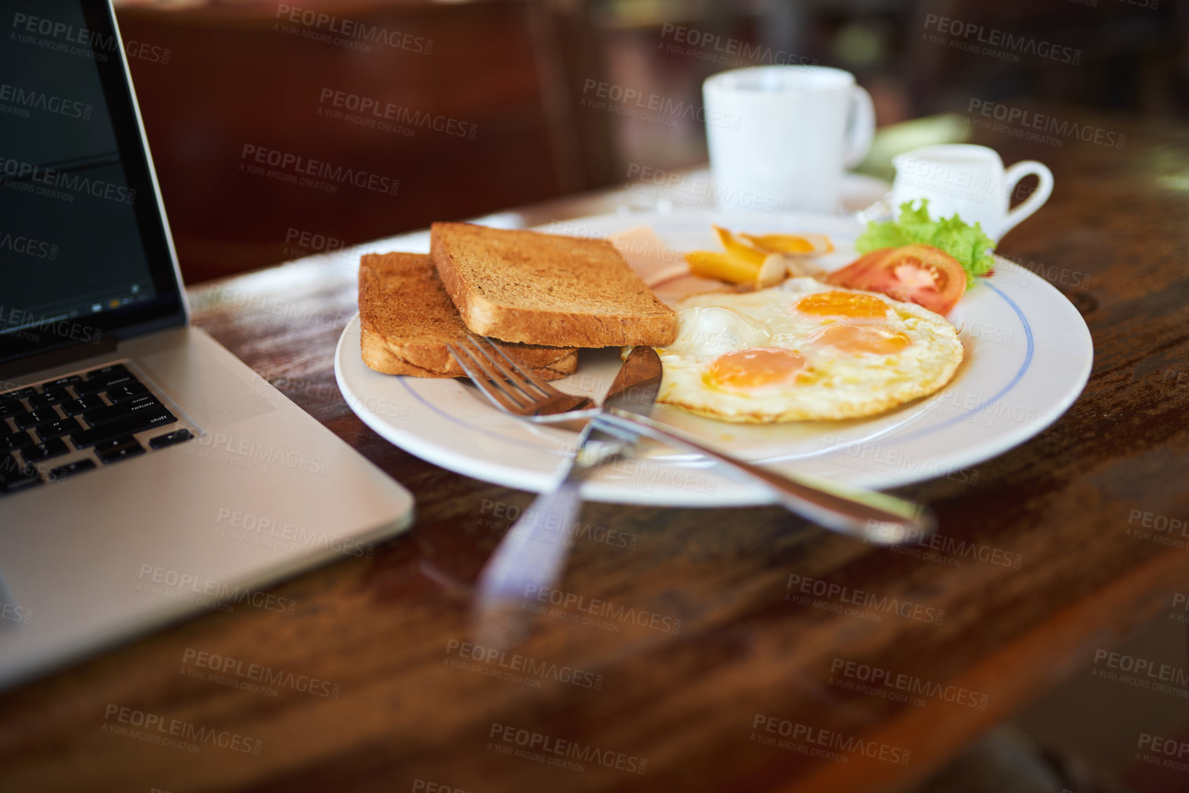 Buy stock photo High angle shot of freshly made breakfast sitting next to a laptop