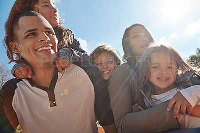 Buy stock photo Shot of a happy family spending time together outdoors