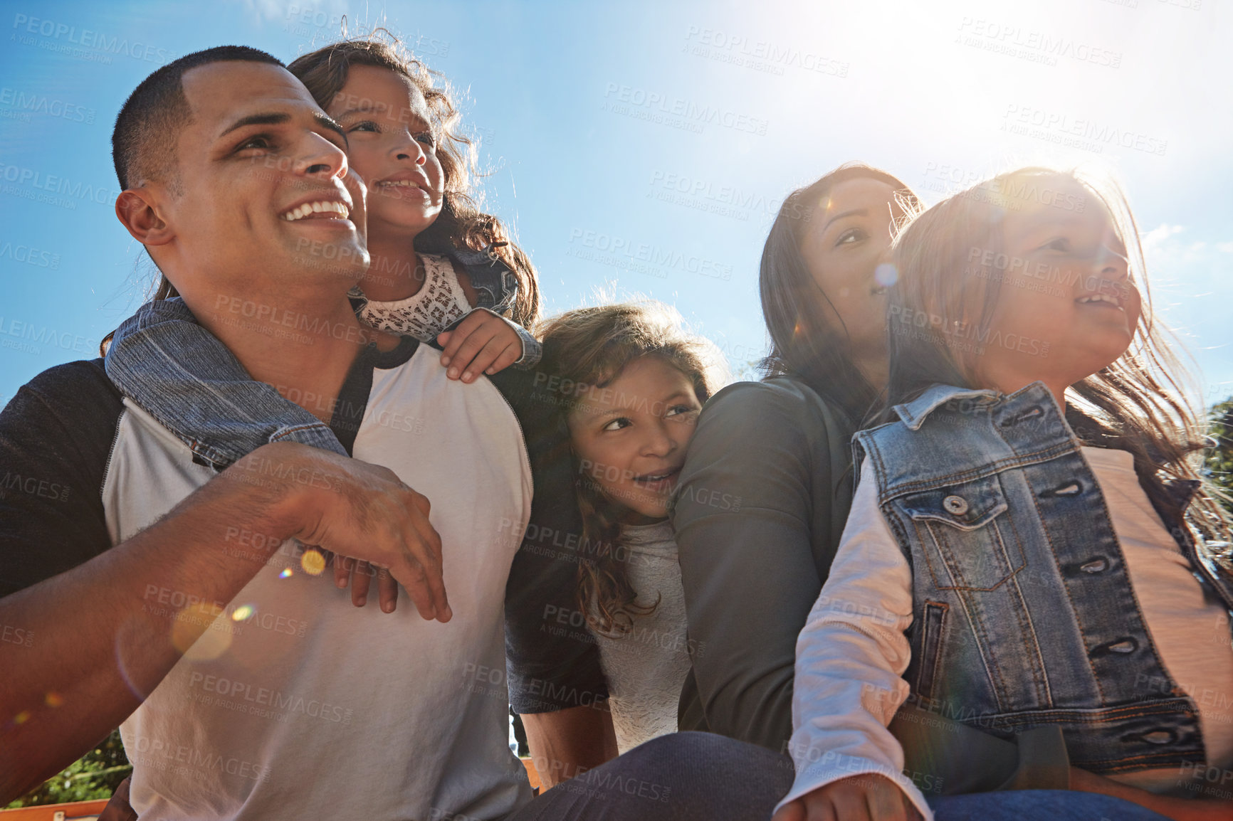 Buy stock photo Shot of a happy family spending time together outdoors