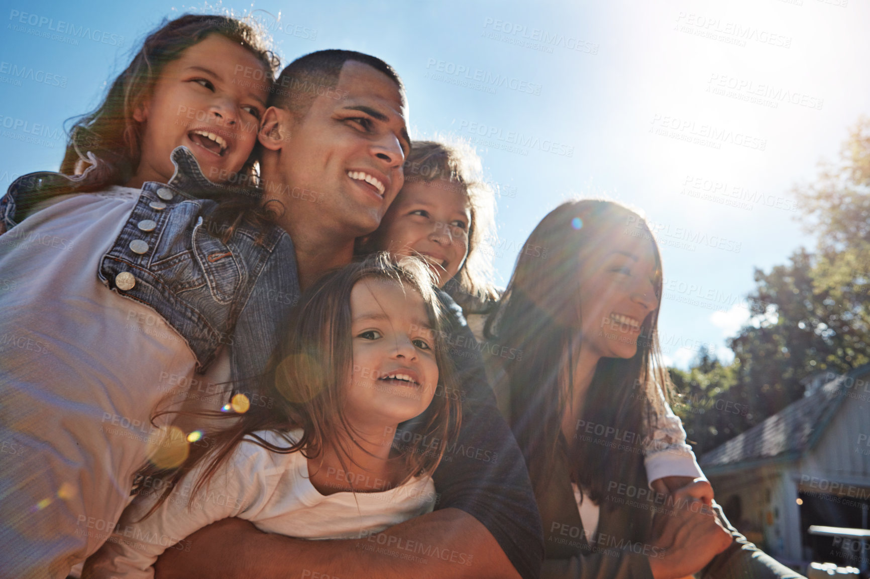 Buy stock photo Shot of a happy family spending time together outdoors