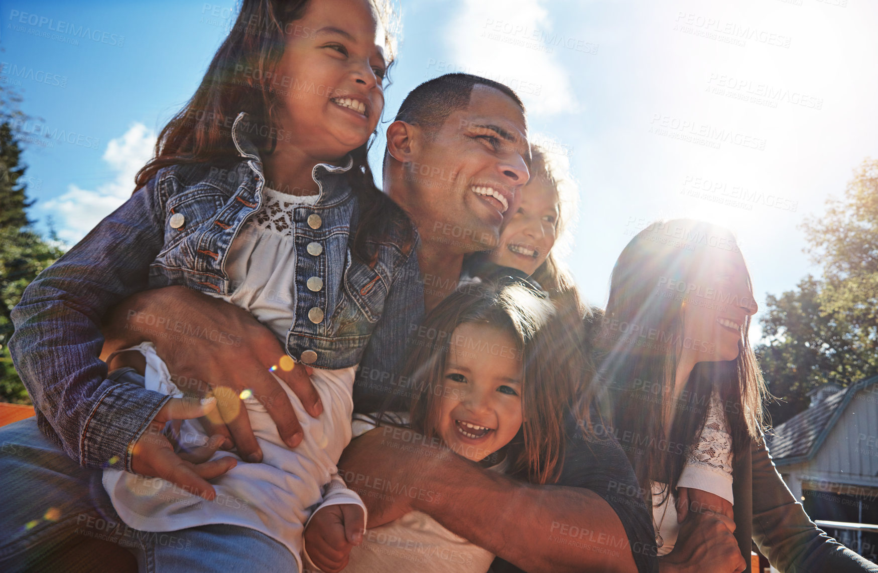 Buy stock photo Portrait of a happy family spending time together outdoors