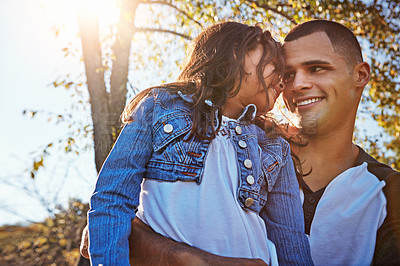 Buy stock photo Shot of a happy father and daughter spending time together outdoors