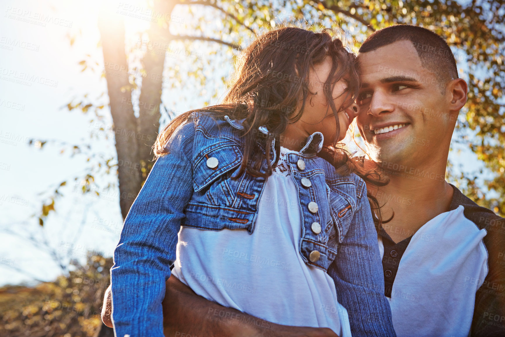 Buy stock photo Shot of a happy father and daughter spending time together outdoors