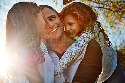 Buy stock photo Shot of a happy young man spending time with his daughters outdoors