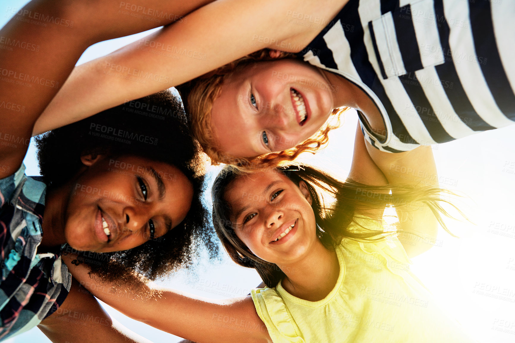 Buy stock photo Happy, low angle and portrait of kids on camp for friendship, playing and fun together. Diversity, youth and girls huddle in circle for childhood, game and support at school, recess and playground