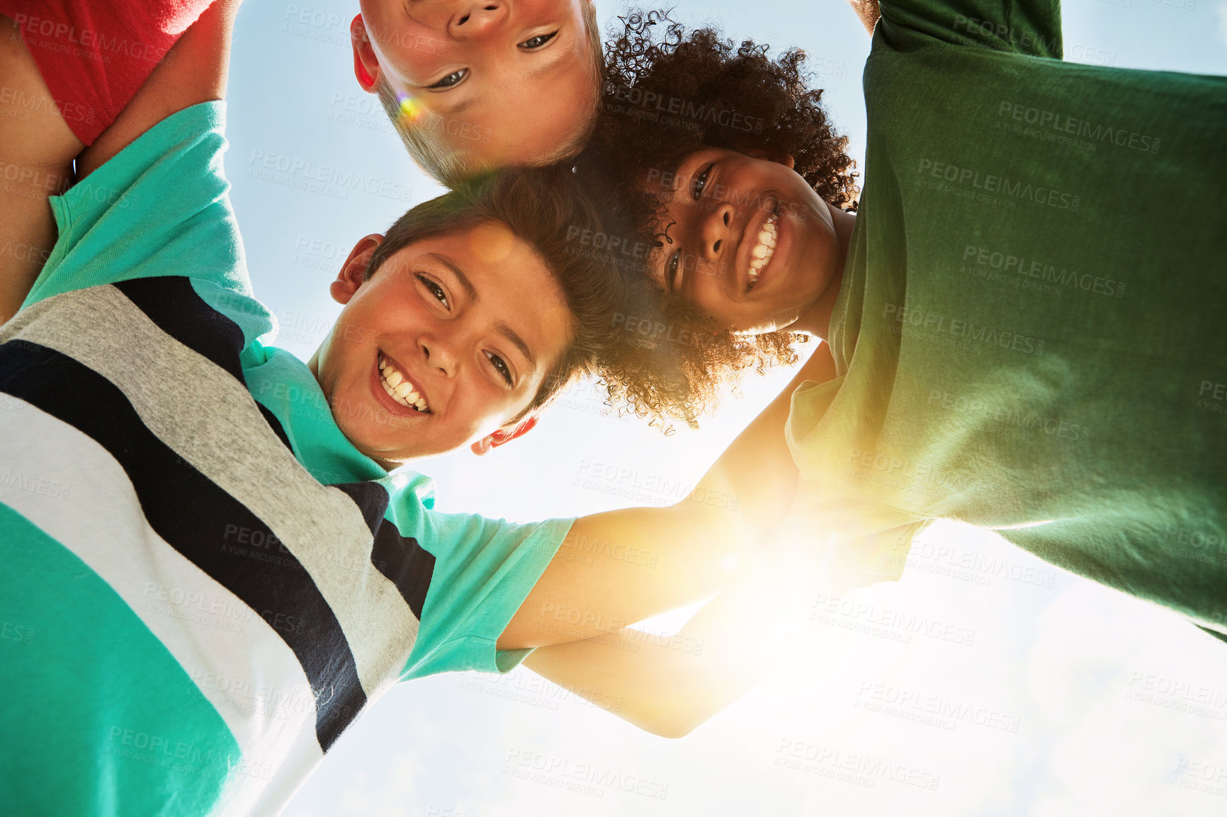 Buy stock photo Happy, low angle and portrait of friends on camp for joy, playing and fun together. Diversity, youth and boys huddle in circle for childhood, game and hug for school, recess and playground in summer