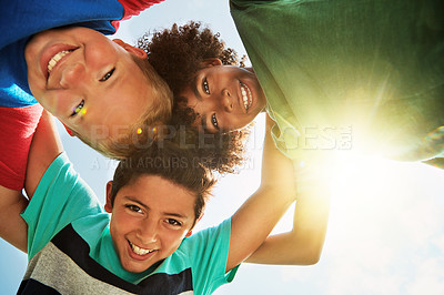 Buy stock photo Friends, low angle and portrait of children on camp for friendship, playing and fun together. Diversity, youth and boys huddle in circle for childhood, game and hug for school, recess and playground