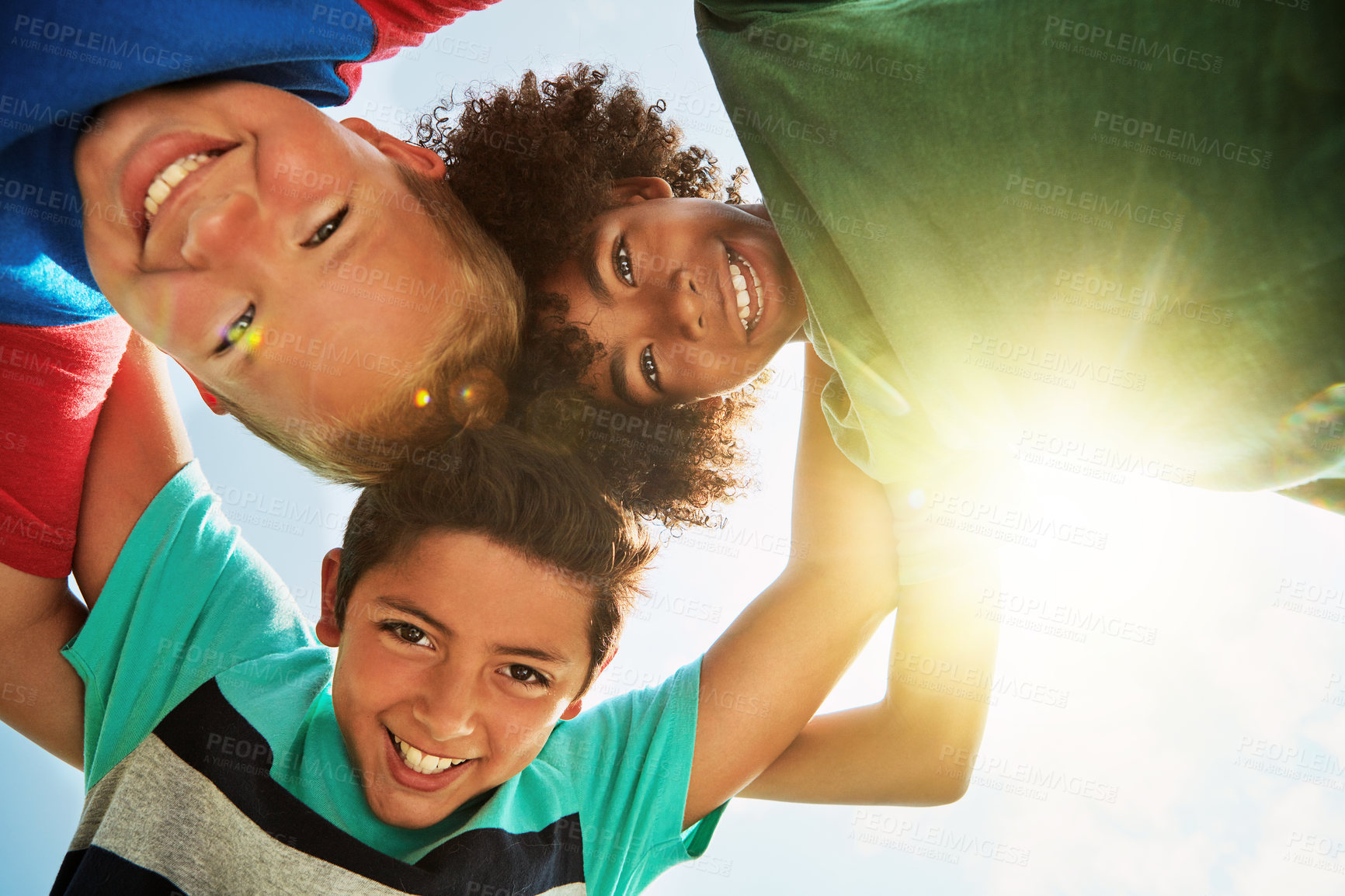 Buy stock photo Friends, low angle and portrait of children on camp for friendship, playing and fun together. Diversity, youth and boys huddle in circle for childhood, game and hug for school, recess and playground