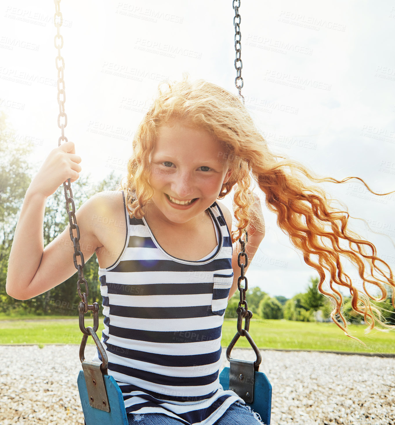 Buy stock photo Preschool girl, portrait and smile with park, swing and nature for outdoor fun or play with fresh air. Child, tree or playground with summer, freedom or school holiday or break outside with happiness