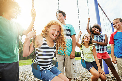 Buy stock photo Cropped shot of a group of young children playing together at the park