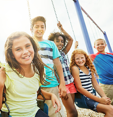 Buy stock photo Portrait of a group of young children playing together at the park