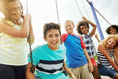 Buy stock photo Cropped shot of a group of young children playing together at the park